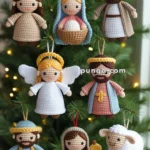 Handcrafted crochet Christmas ornaments depicting a nativity scene with various figures, including an angel, shepherd, and sheep, hanging on a Christmas tree with twinkling lights.