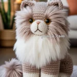 A plush knitted cat with fluffy fur, sitting on a braided rug in a cozy living room setting.