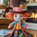 A crocheted doll resembling a whimsical character stands on a table, dressed in a colorful patchwork outfit with a top hat featuring a 10/6 card and decorative flowers. The background includes a cozy room with a fireplace and a lamp.