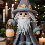 A crocheted wizard doll with a long white beard, wearing a pointed hat adorned with stars, and holding a small lantern, standing on a wooden table surrounded by books and candles.