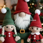 Three crocheted Christmas figures, including a gnome with a red hat and white beard, a doll with green hat and red dress, and an elf with a red outfit and green pants, are displayed on a wooden surface with a festive holiday background.
